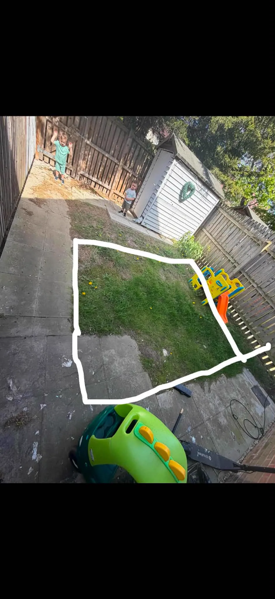 Small family garden with the new lawn and path layout marked out