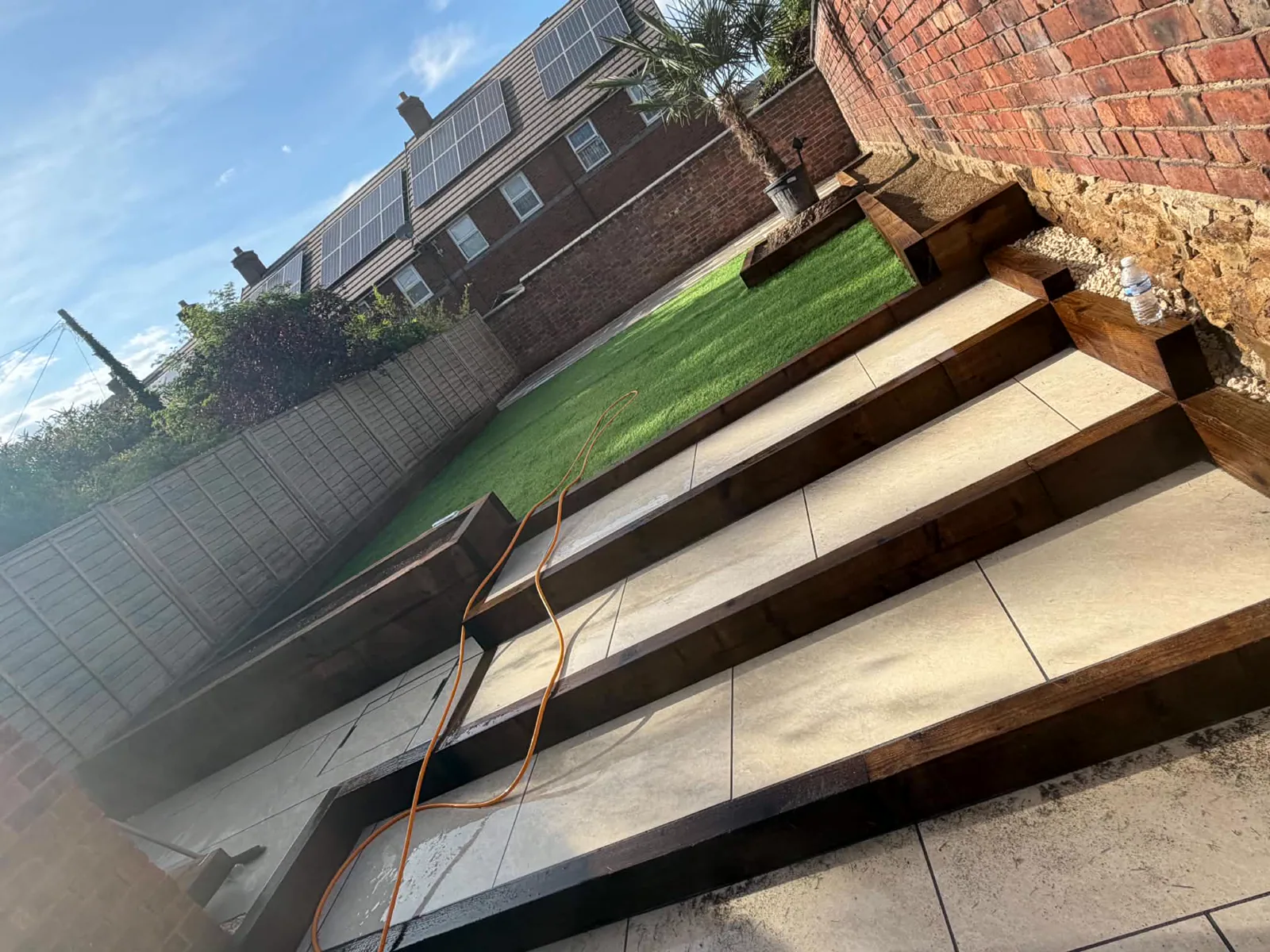 Garden renovation with new steps and artificial lawn