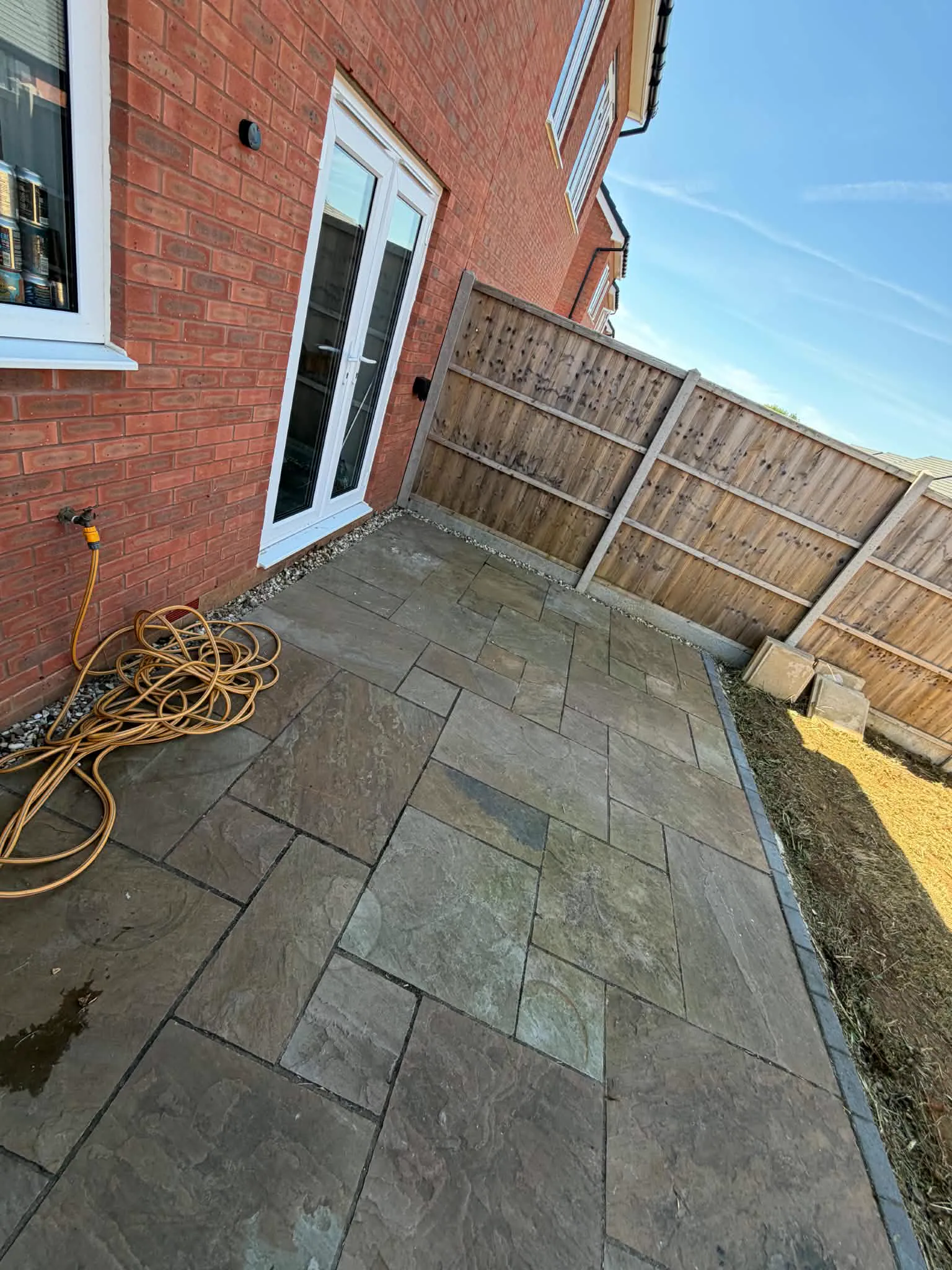 New patio and paved path installed in a Northamptonshire garden